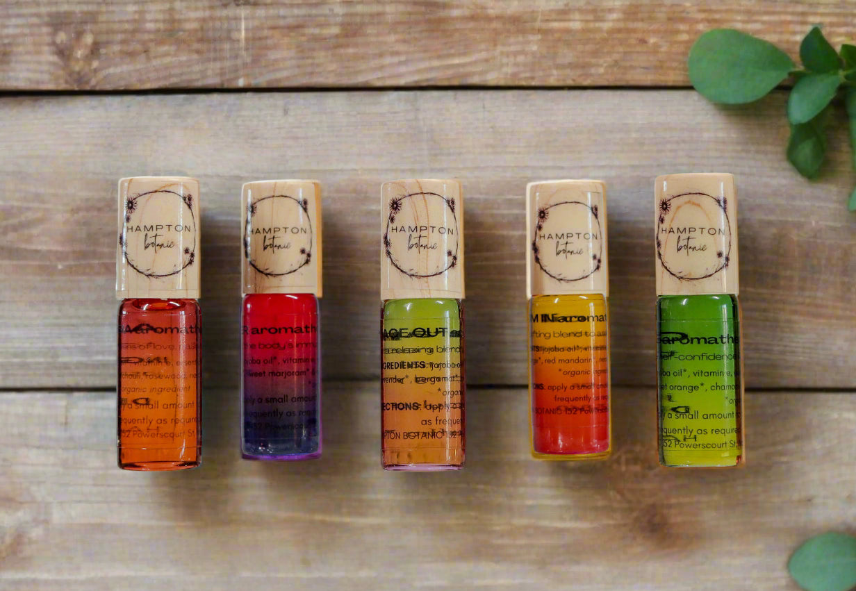 Five Colourful Aromatherapy Roller Bottles in a boho bathroom